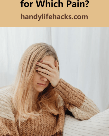 woman with a headache with her hand covering her eyes and forehead