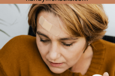 woman looking at medication in her hand
