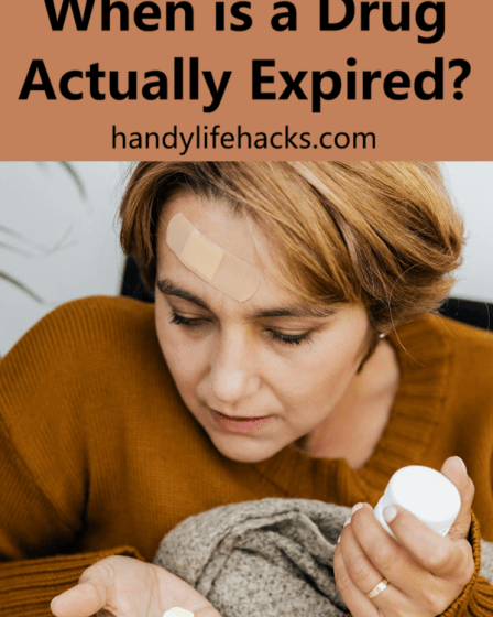 woman looking at medication in her hand