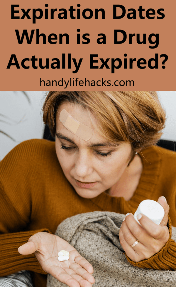 woman looking at medication in her hand