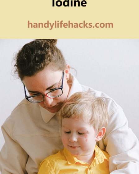 woman bandaging boys hand