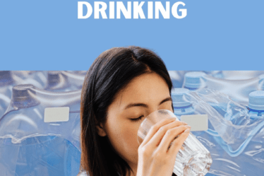 woman drinking a glass of water